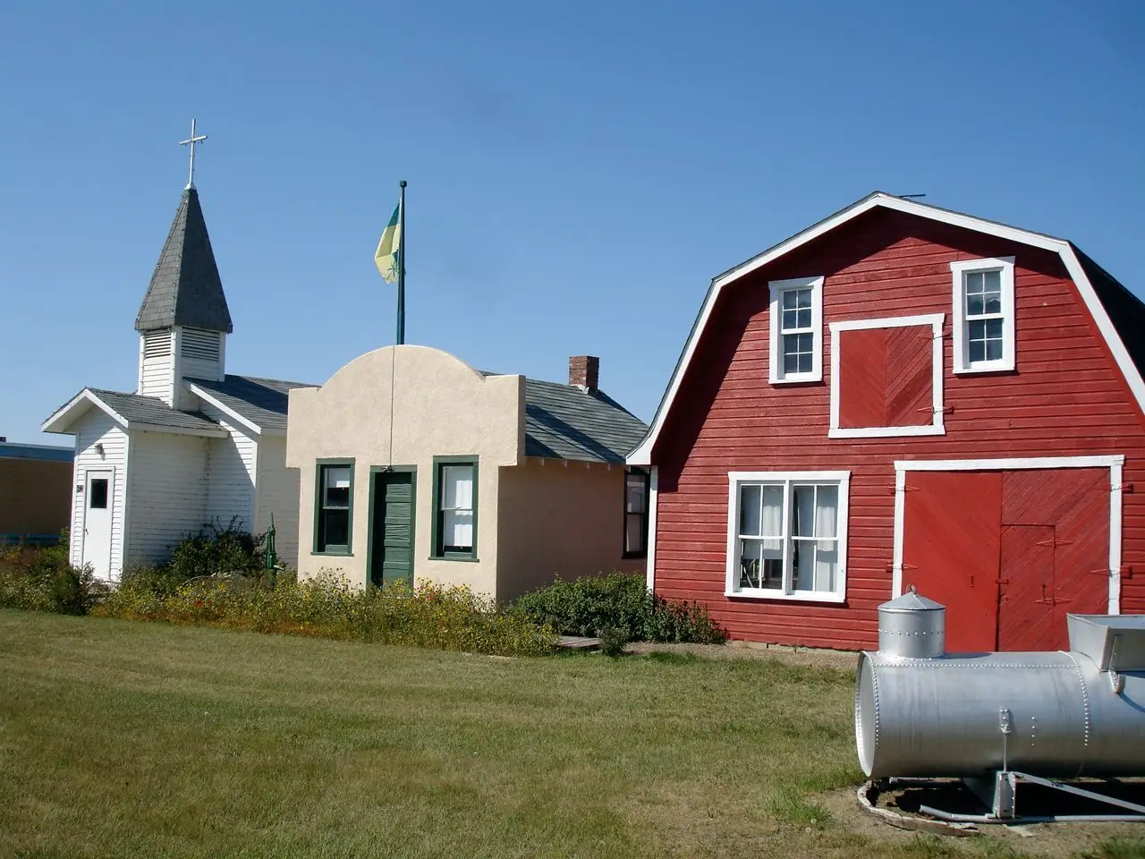 Museum buildings: church, small building and red barn